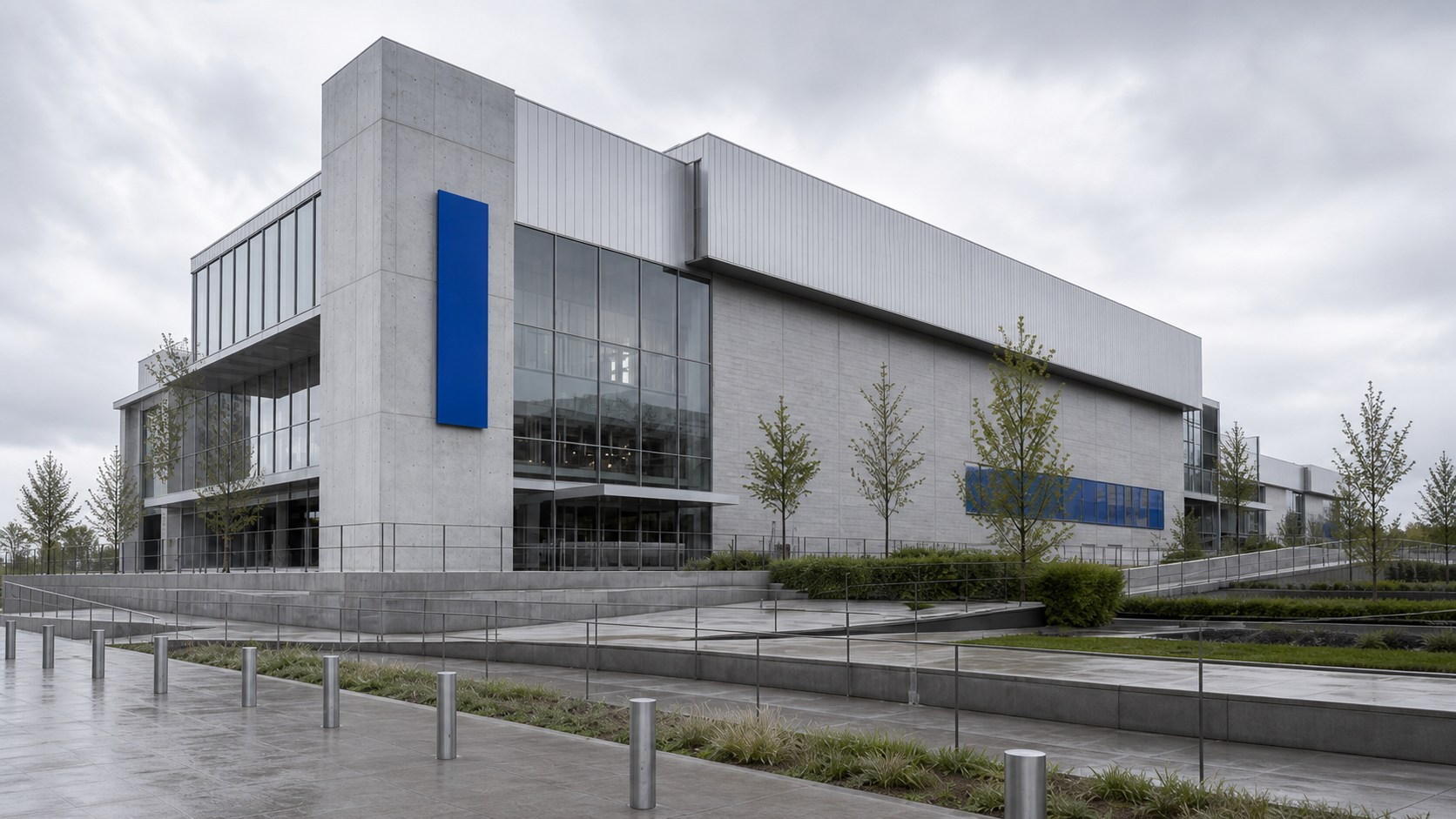 Concrete cultural building framed by a cobalt wayfinding plane